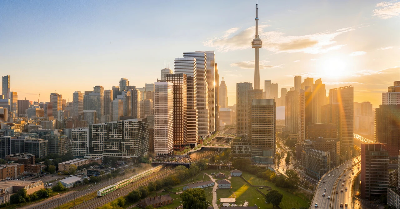 Aerial view of a city skyline during sunset, featuring tall skyscrapers, including a tower, with sun rays creating a warm glow over the buildings and streets.